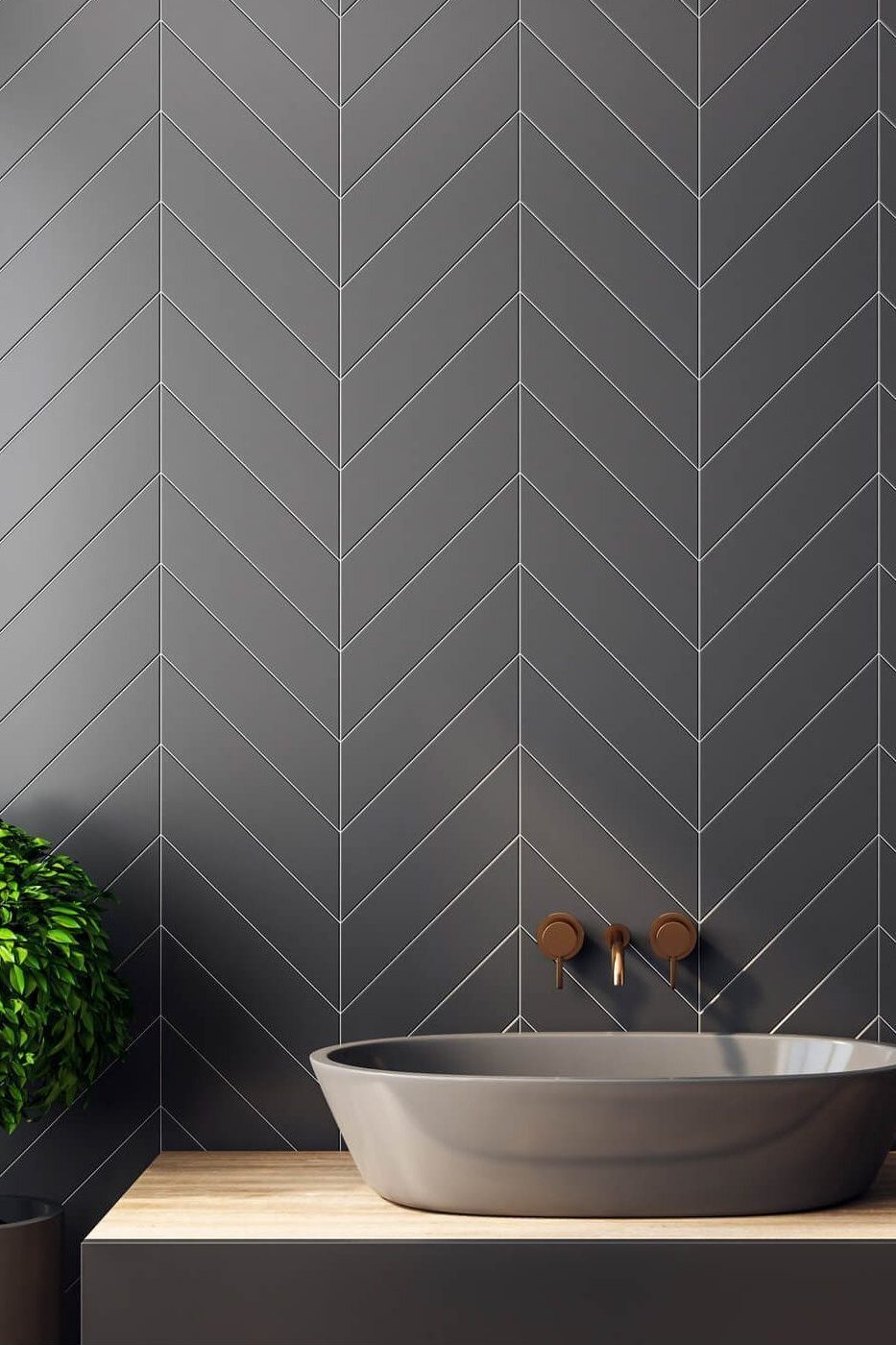 Chevron-laid matte tile powder bath with brushed fixtures and floating wood vanity